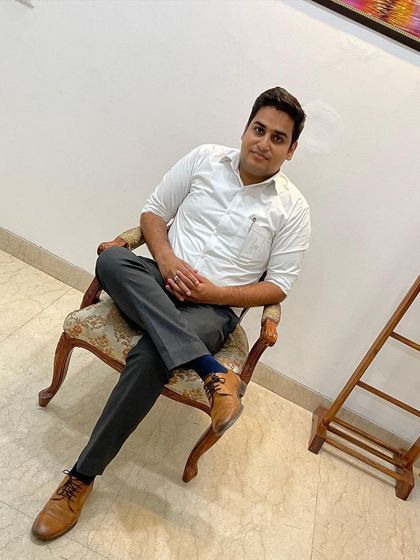 A simple, seated portrait. My focus is always on providing clear, no-nonsense legal services.