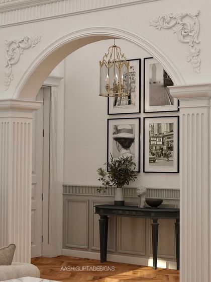 A detail of a classical archway, showcasing the fluted columns and ornate mouldings that are hallmarks of my style. These architectural elements add a sense of history and grandeur to any room.