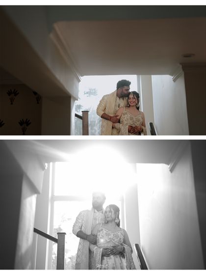 A creative play of light and shadow, capturing the couple in a tender embrace on a staircase during their engagement shoot.