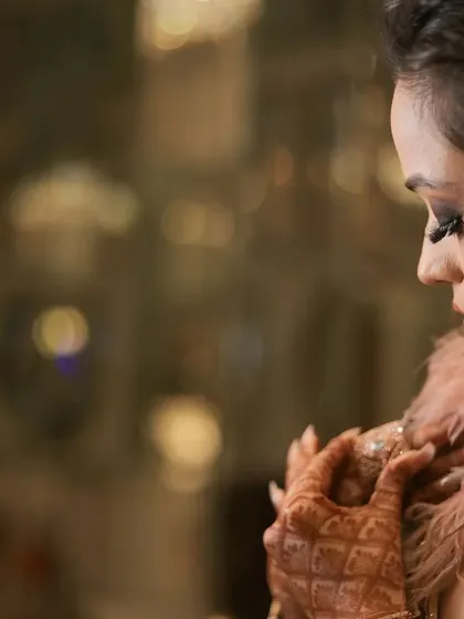 A beautiful, moody portrait of the bride during her engagement, capturing her thoughtful expression.