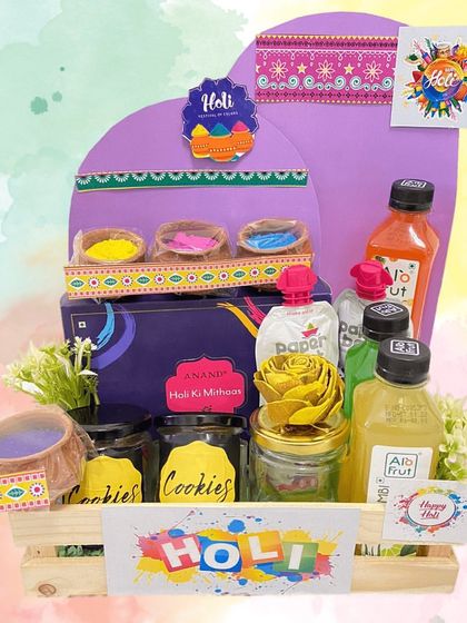A 'Holi ki Mithas' (Sweetness of Holi) hamper that combines traditional and modern treats. It includes jars of cookies, organic colours, and refreshing fruit juices.