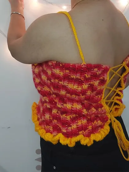 The back of the Daisy Babe Top features a full corset-style lacing, which allows for a perfectly cinched and adjustable fit.