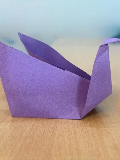 A close-up of a purple origami swan, carefully folded by a student in our paper craft session. Learning origami helps develop precision, focus, and the ability to follow instructions.