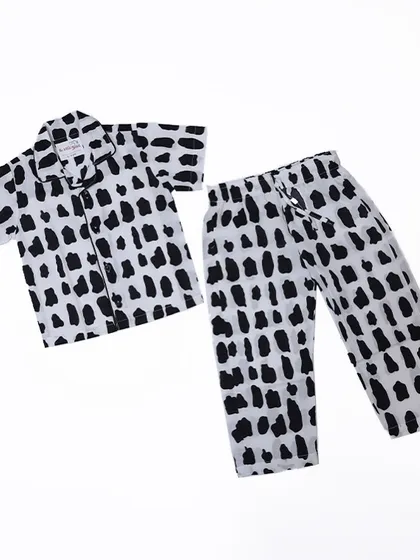 A flat lay of our modern and unisex Rocky print pyjama set. The black and white abstract pattern is a stylish choice for any child.