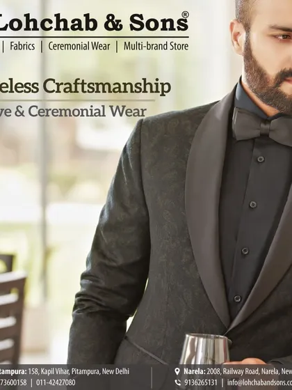 Priceless craftsmanship is evident in every detail. This close-up highlights the subtle texture of the fabric and the smooth curve of the shawl lapel on this all-black tuxedo, perfect for a sophisticated evening look.