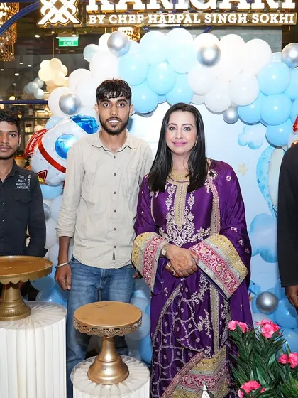 A group photo of my dedicated team with actress Sanjjanaa Galrani. It takes a team to bring these big visions to life, and I'm proud of every one of them.