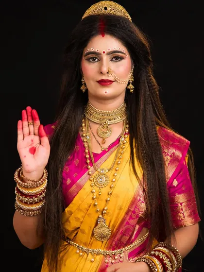 A blessing pose from the Skandmata look, showcasing the student's attention to traditional details.