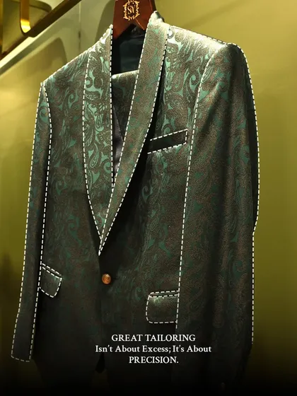 Great tailoring is not about excess, it is about precision. This image highlights the clean lines and sharp silhouette of a patterned formal suit, demonstrating how a perfect fit defines the garment.