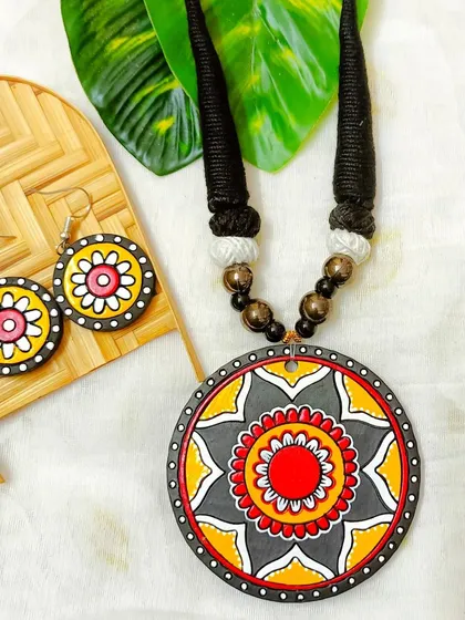 A classic yellow, red, and gray version of the circular mandala pendant necklace.