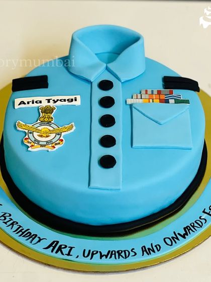 A special retirement cake for an Air Force Officer. I recreated the uniform shirt as a fondant cake, complete with the insignia, name tag, and service ribbons.