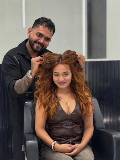 A happy client showing off her new copper glow. The color adds so much warmth and personality to her look, and the voluminous styling is the perfect finish.