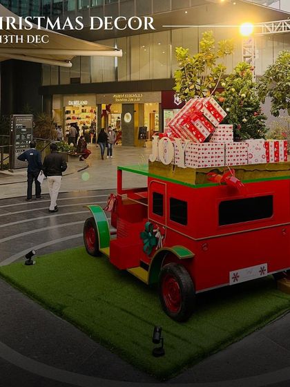A vintage car loaded with presents, part of our whimsical Christmas decor. We go all out to create a magical, photo-worthy environment for our guests during the holidays.