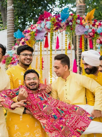 The groom's squad in action. The fun and mischief of a Haldi ceremony are just as important to the story as the romance.