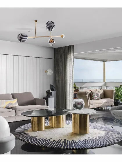 We designed this sea-facing apartment to be a story of its surroundings. The living room features custom sofas and a sculptural center table, all oriented to embrace the sprawling ocean views. The furniture is minimal yet luxurious, ensuring the focus remains on the horizon.