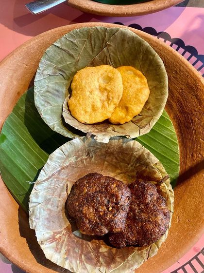 More dishes from our Bastar food festival, served traditionally in leaf bowls. This image showcases Dehati Vadas and Chila, giving guests a true taste of Chhattisgarh's tribal cuisine.