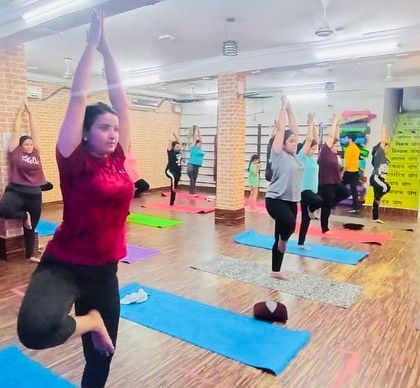 Another look at our group practicing the tree pose. It's a wonderful way to start or end a class, finding stillness and stability.