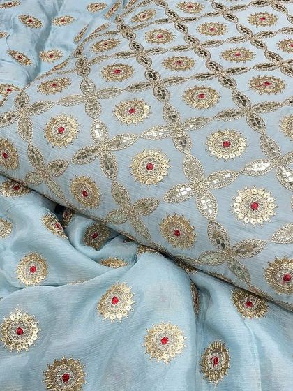 A serene powder blue Chinon fabric, detailed with fine Gotta Patti work. I find this material is perfect for designers looking to create unique, high-quality ethnic ensembles.
