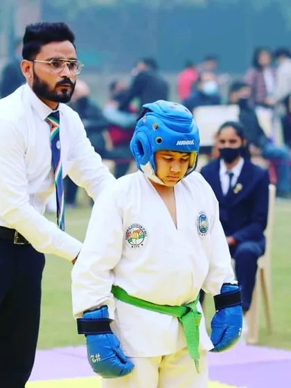 Coaching from the sidelines is just as important as training in the gym. Here I am guiding one of my young fighters during a break in his sparring match.