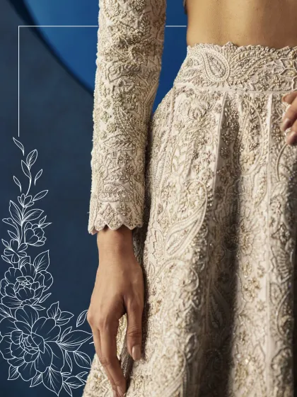 The soul of my collection lies in its intricate surfaces and artisanal finishes. This close-up reveals the delicate paisley embroidery and hand-sewn details that transform a beautiful garment into a piece of wearable art.