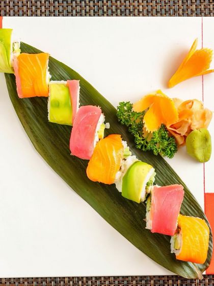 Our Niji Maki Sushi, also known as the Rainbow Roll, is a vibrant fusion of flavors. Each piece is a perfect harmony of fresh tuna and salmon wrapped around creamy avocado and crisp cucumber.