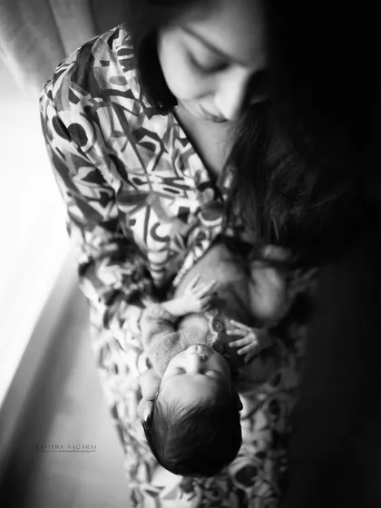 Happy Mother's Day. This artistic black and white shot of a mother looking down at her baby is a timeless tribute to the unbreakable bond they share.