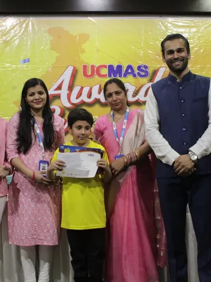 A young achiever with his family and our team member at the NLC Awards Ceremony. We foster a community where parents and franchisees work together to support student success.