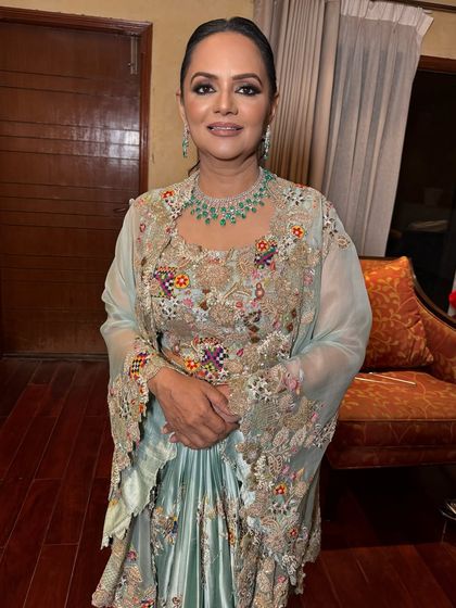 A glowing goddess. This client looks absolutely stunning in her Anamika Khanna outfit, with makeup that is both glamorous and sophisticated.