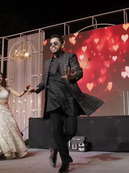 The couple owning the stage with their fun and energetic Sangeet dance. We make sure to capture the performance from various angles.