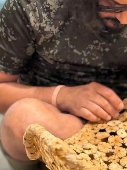 Here I am in the studio, making final touches to a piece. This image captures the hands-on, personal nature of my work, where every detail is carefully considered and crafted by hand.