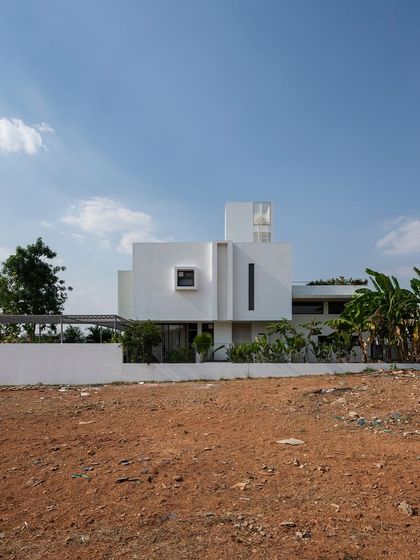 The SAMAM House exterior, highlighting its strong, block-like volumes against the sky. The design's simplicity is a direct response to the client's budget and our philosophy of creating elegant, functional architecture.