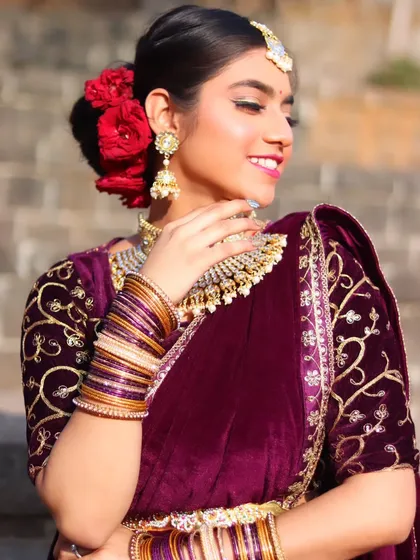 A sun-kissed shot of the bride, her smile radiant and her makeup glowing.