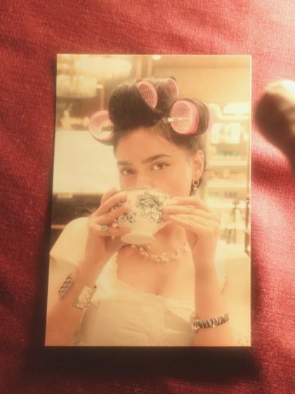 A polaroid-style image of the same scene, adding a nostalgic and dreamy filter to the behind-the-scenes glam moment.