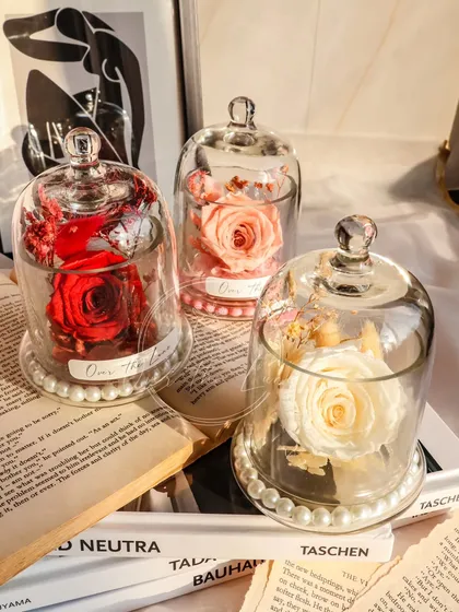 For a love that's eternal, I create these preserved rose keepsakes. Real roses that last for years are carefully arranged inside a beautiful glass dome, making for a truly special and lasting gift.