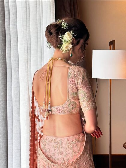The complete back view, showing how the hairstyle works with the blouse and jewelry. It's all about creating a balanced and harmonious look.