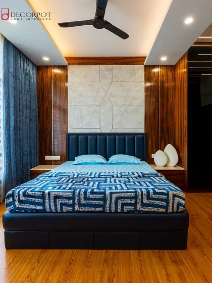 Your bedroom is your sanctuary. We crafted this space with a focus on tranquility, featuring a luxurious upholstered headboard, rich wood tones, and layered lighting to create a perfect retreat from the outside world.