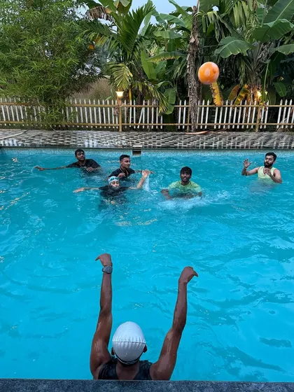 Team members enjoying a relaxing swim in the resort's private pool. My custom itineraries balance high-energy activities with plenty of downtime for your group to recharge.