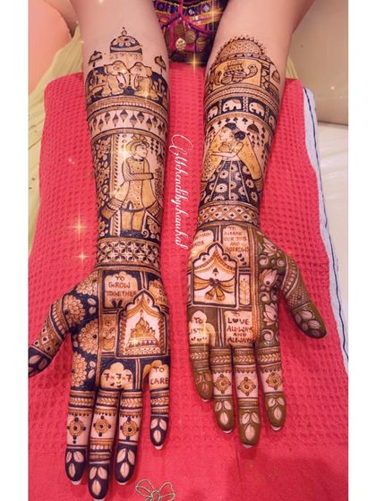 A different view of the bridal mehendi with wedding vows and couple portraits.