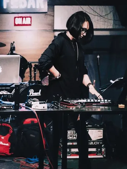 Performing a DJ set using Ableton Live and an Akai APC40. This setup offers incredible creative freedom, allowing for on-the-fly remixing and looping. I teach the fundamentals of DJing with Ableton from the ground up.