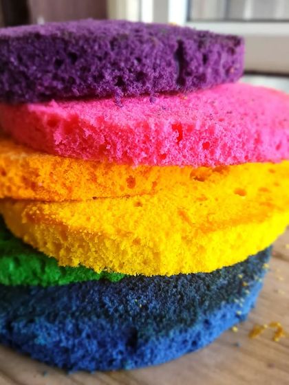 Here's what the inside of our rainbow cake looks like. These are the vibrant, colorful layers of sponge before they are stacked and frosted.