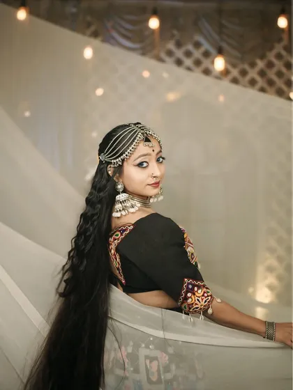 An over-the-shoulder look from the 'Halo re Halo' shoot, highlighting the hair accessories and jhumkas.
