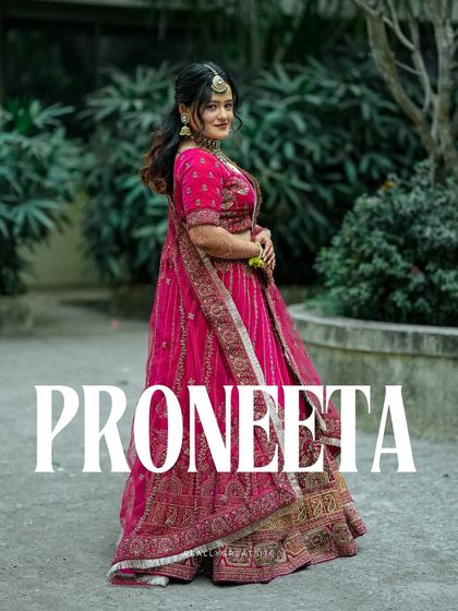 A stylish portrait of the bride, Proneeta. This shot highlights her confidence and the elegance of her wedding day look.