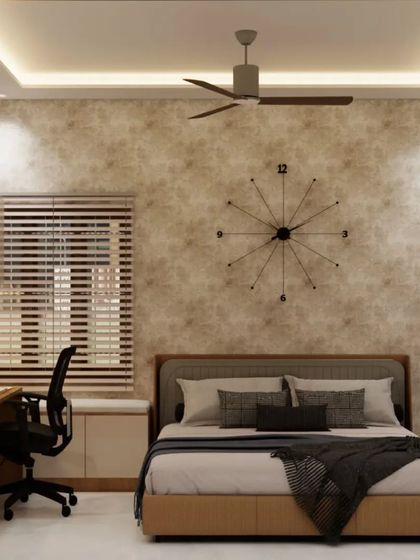 This bedroom features a textured wallpaper accent wall with a large, minimalist clock, and a functional study desk.