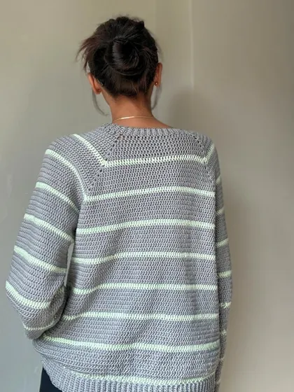 The back view of the striped sweater, showing the raglan sleeve construction which gives it a great shoulder fit.