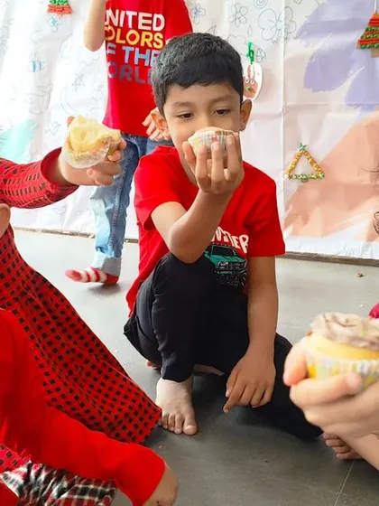 A collection of joyous moments from our Christmas party, including dancing, enjoying cupcakes, building a sand snowman, and posing for group photos.