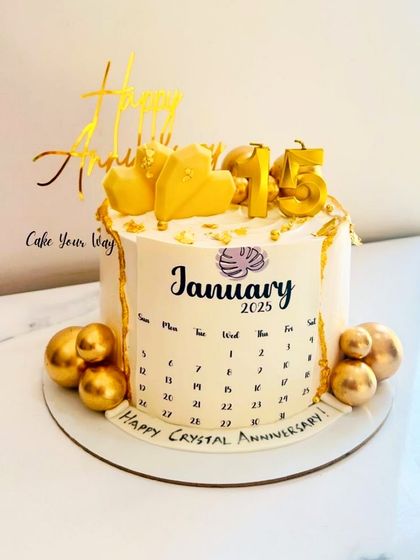 Golden moments for a Crystal Anniversary. A unique calendar cake marking 15 years together.