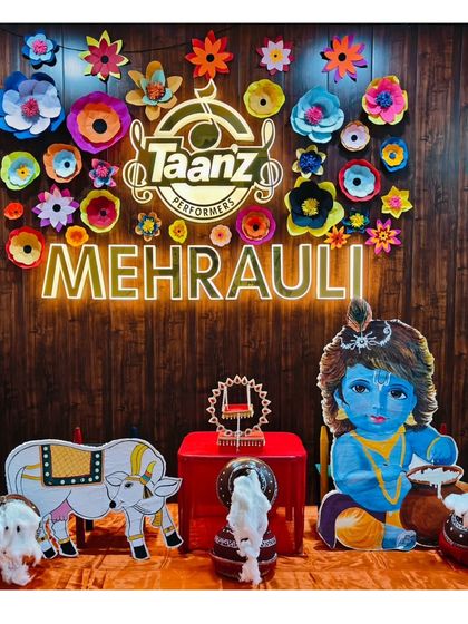 A closer look at our Janmashtami decor, featuring handmade paper flowers and a beautifully painted cutout of Bal Krishna.