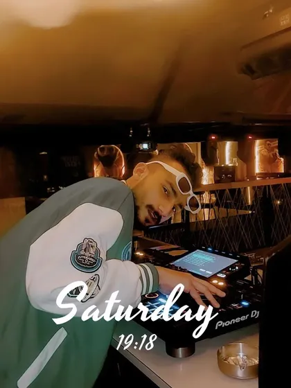 A candid moment during a set. I'm always tuned into the room's energy, adjusting my set to keep the party going.