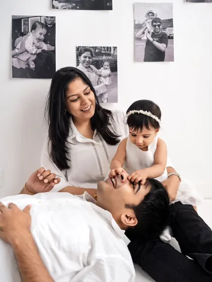 Playtime with dad! These candid interactions are what make a photoshoot so special. This little one is having a great time during her family session.