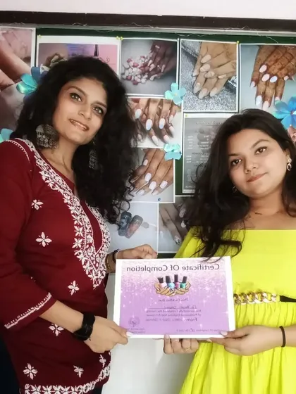 Here I am with a newly certified nail artist. My courses are designed to give you the confidence and credentials to start your own nail art business.
