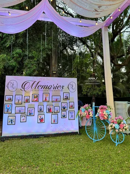 The memory wall setup next to a charming decorative bicycle, adding a whimsical touch.